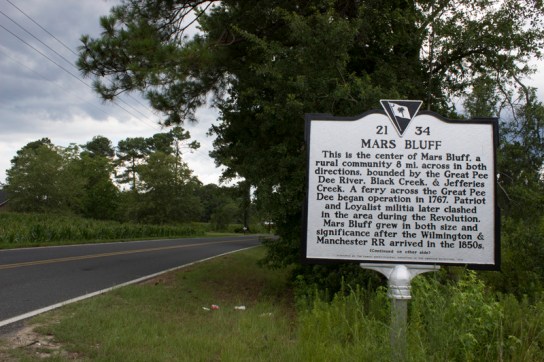 Welcome to the center of Mars Bluff a town, which is eight miles across on both sides.